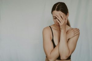 exhausted woman with face in hands Image by Anete Lusina on Pexels