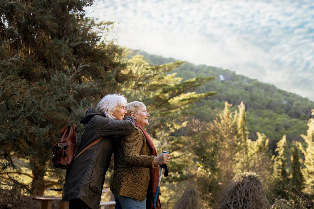 Two senior women enjoying a Hike Image by freepika